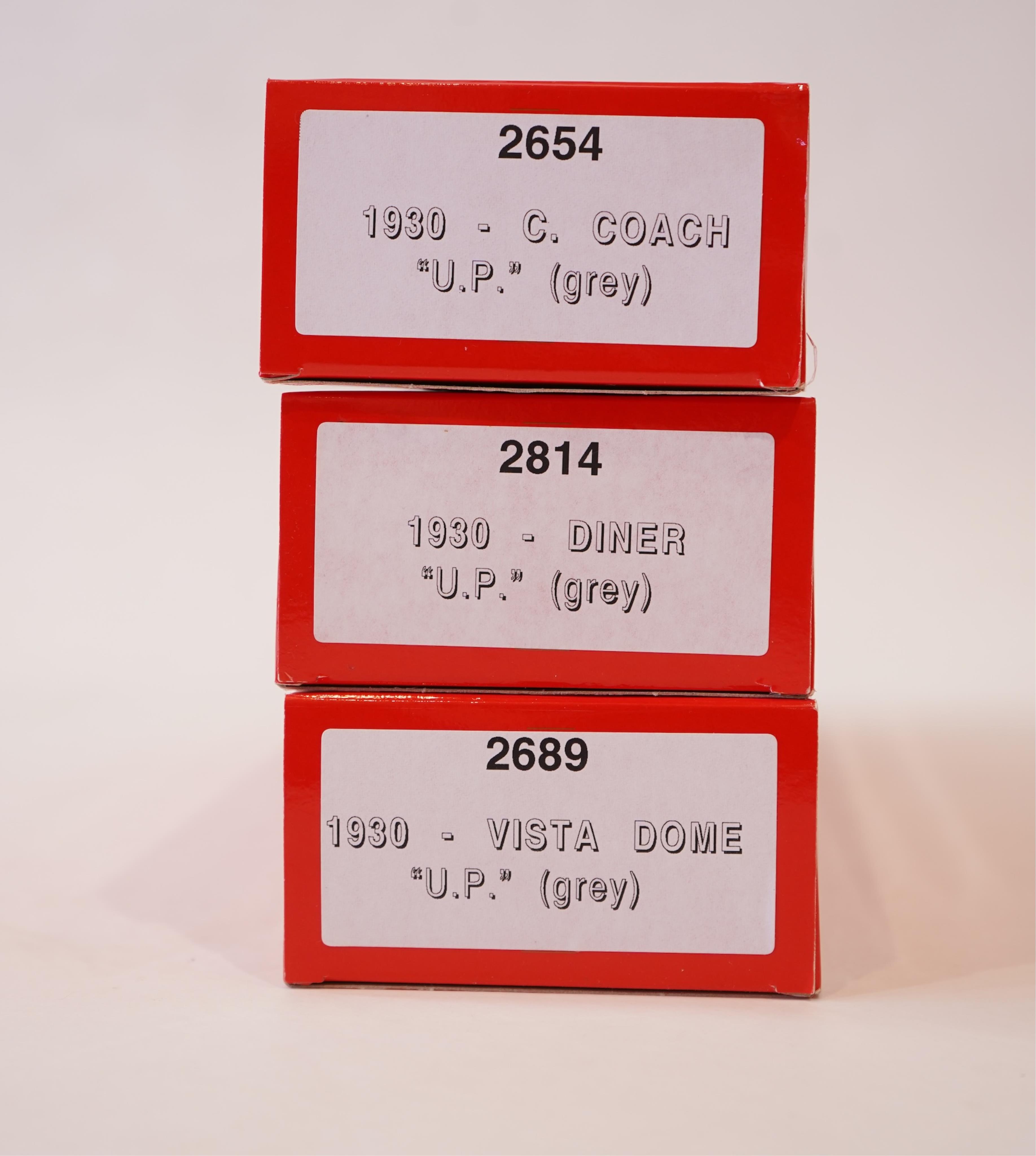 Two boxed Rivarossi 1930s Union Pacific coach packs; A Set (6964) and B Set (6965), both containing four coaches, together with three individually boxed coaches (2654, 2689 and 2814), plus four bogie freight wagons (2255